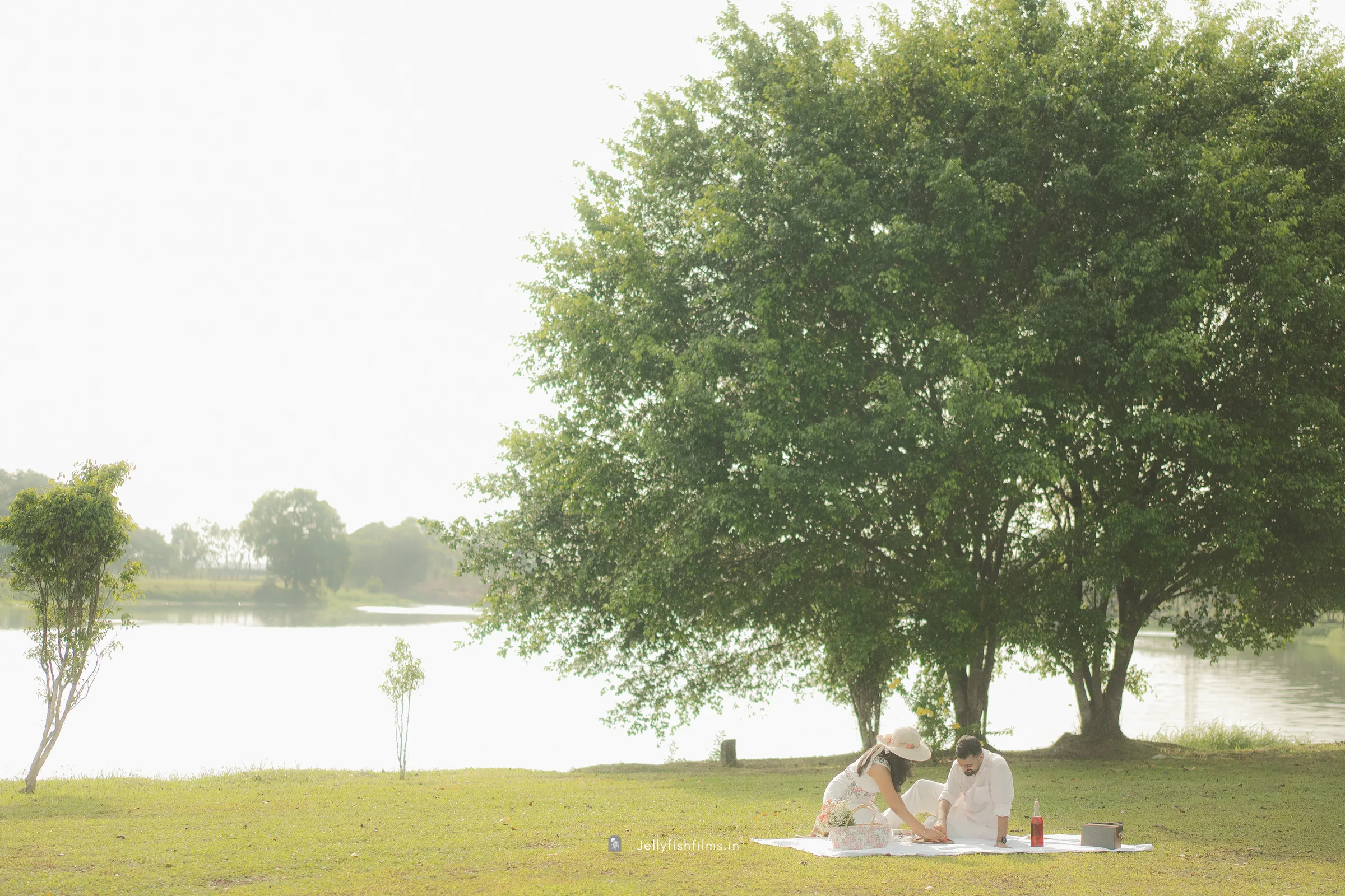 Aaron and Tinu enjoying a picnic by the water