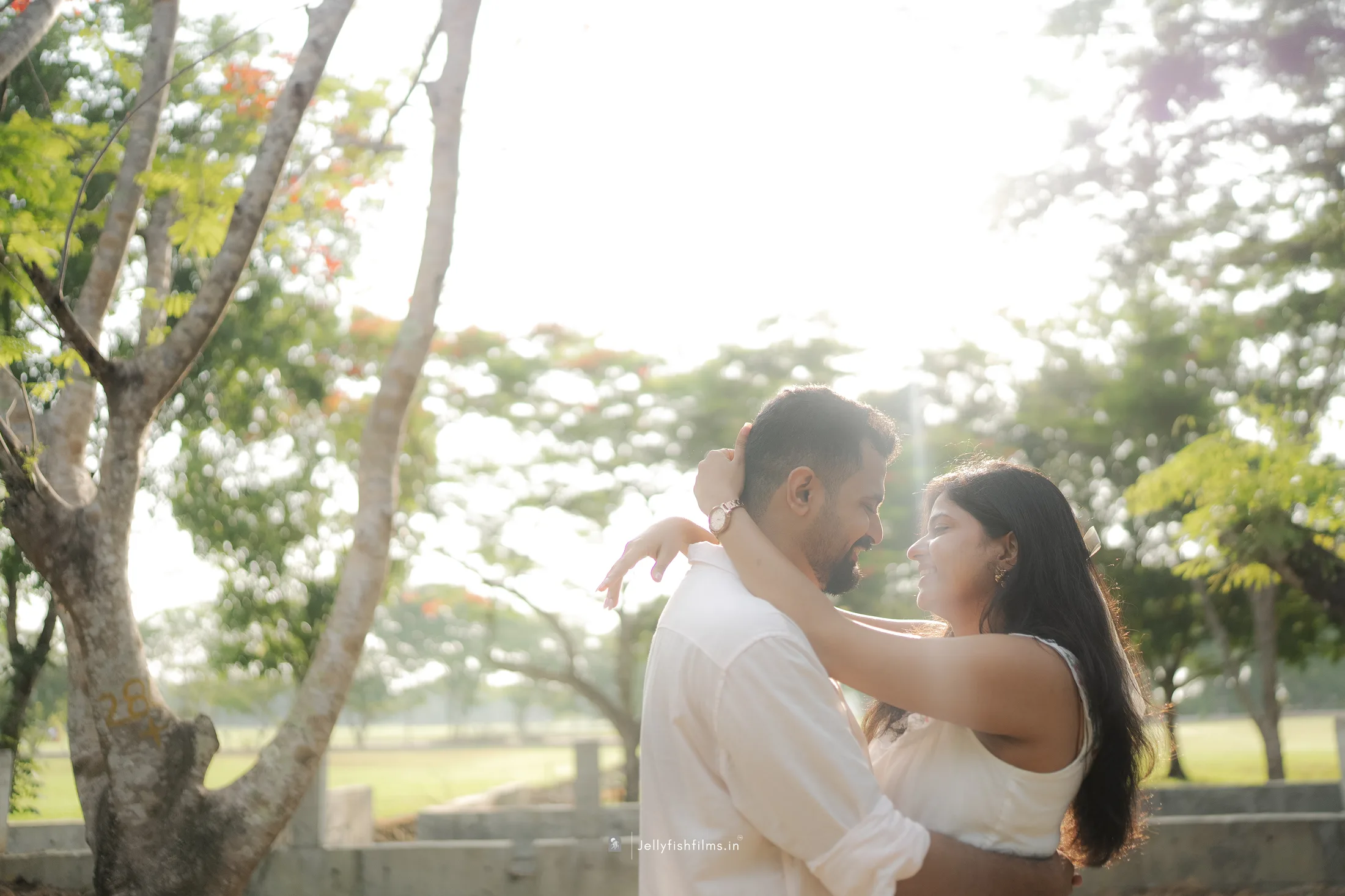 Aaron and Tinu sharing a sunlit moment together